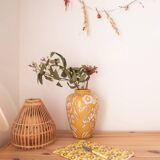 Yellow enamel vase with white flower decoration