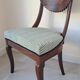 Pair of mahogany gondola chairs – Empire style – 20th century, restored