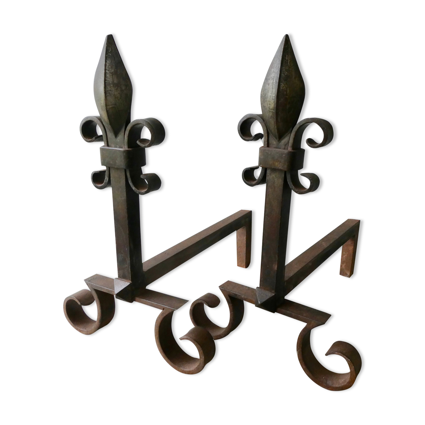 Pair of cast iron and beaten iron chenets, fleurs-de-lis