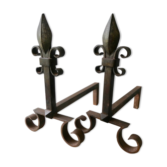 Pair of cast iron and beaten iron chenets, fleurs-de-lis