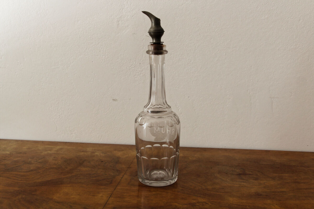 Chiseled glass rum bottle