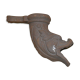 Cast iron gutter downspout in the shape of a dolphin