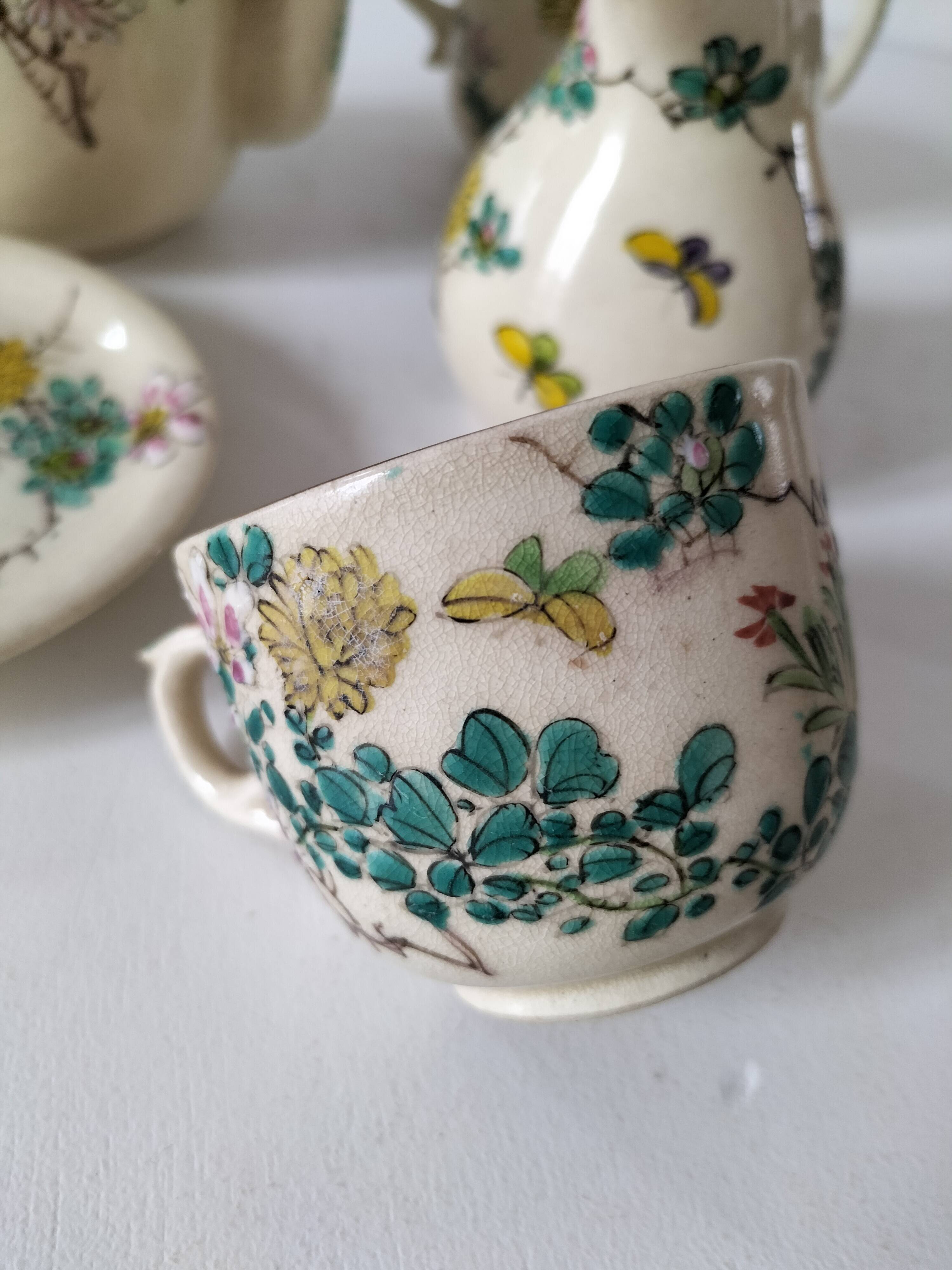 Japanese-style tea set in cracked earthenware with chrysanthemum flowers