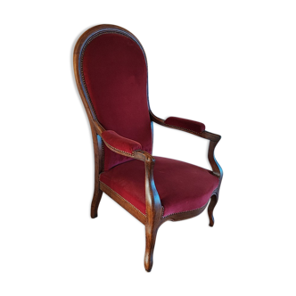Red voltaire armchair