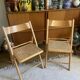 Pair of folding wooden chairs and vintage cannage