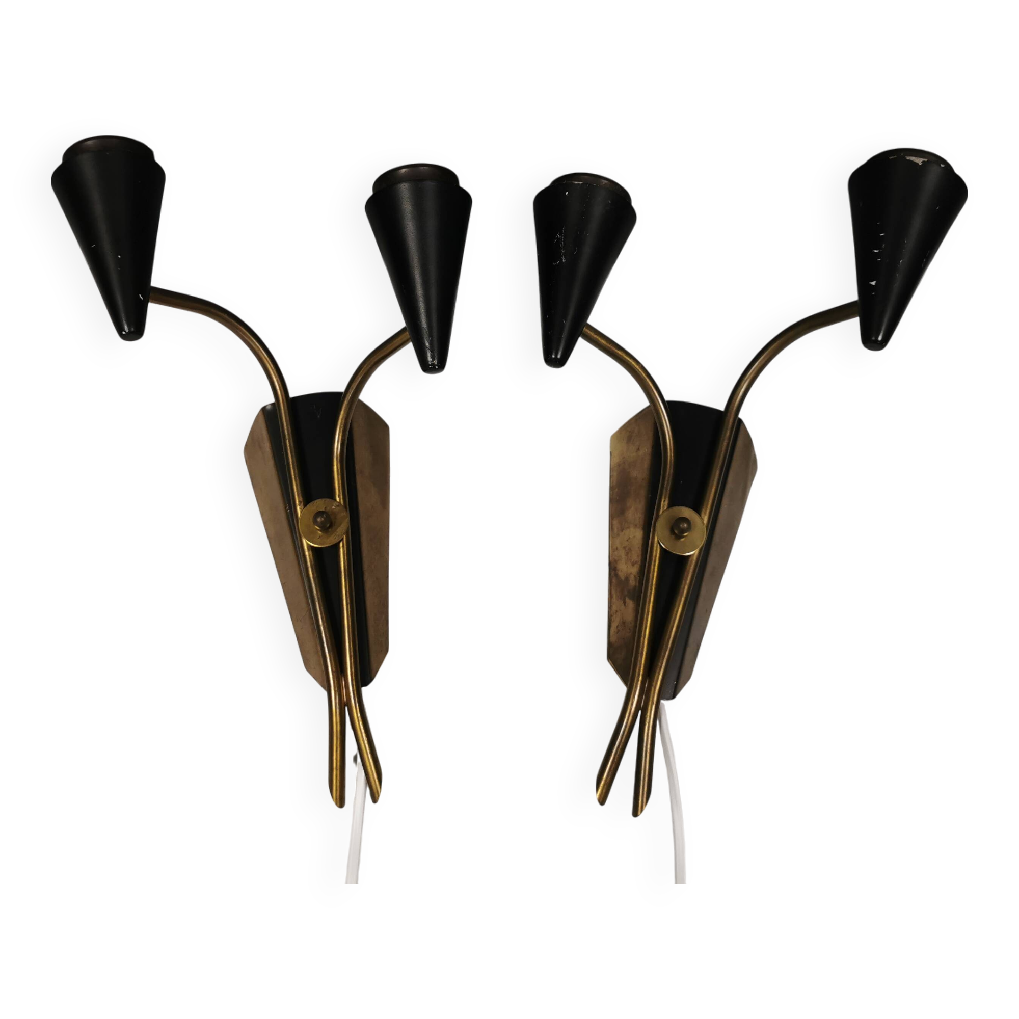 A set of wall lamps in black lacquered metal with brass details
