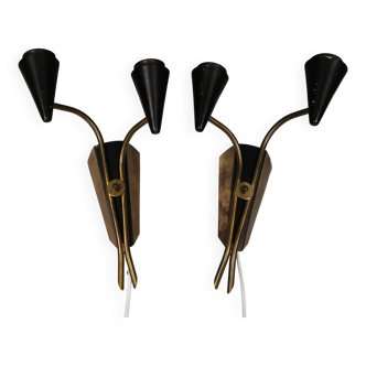 A set of wall lamps in black lacquered metal with brass details