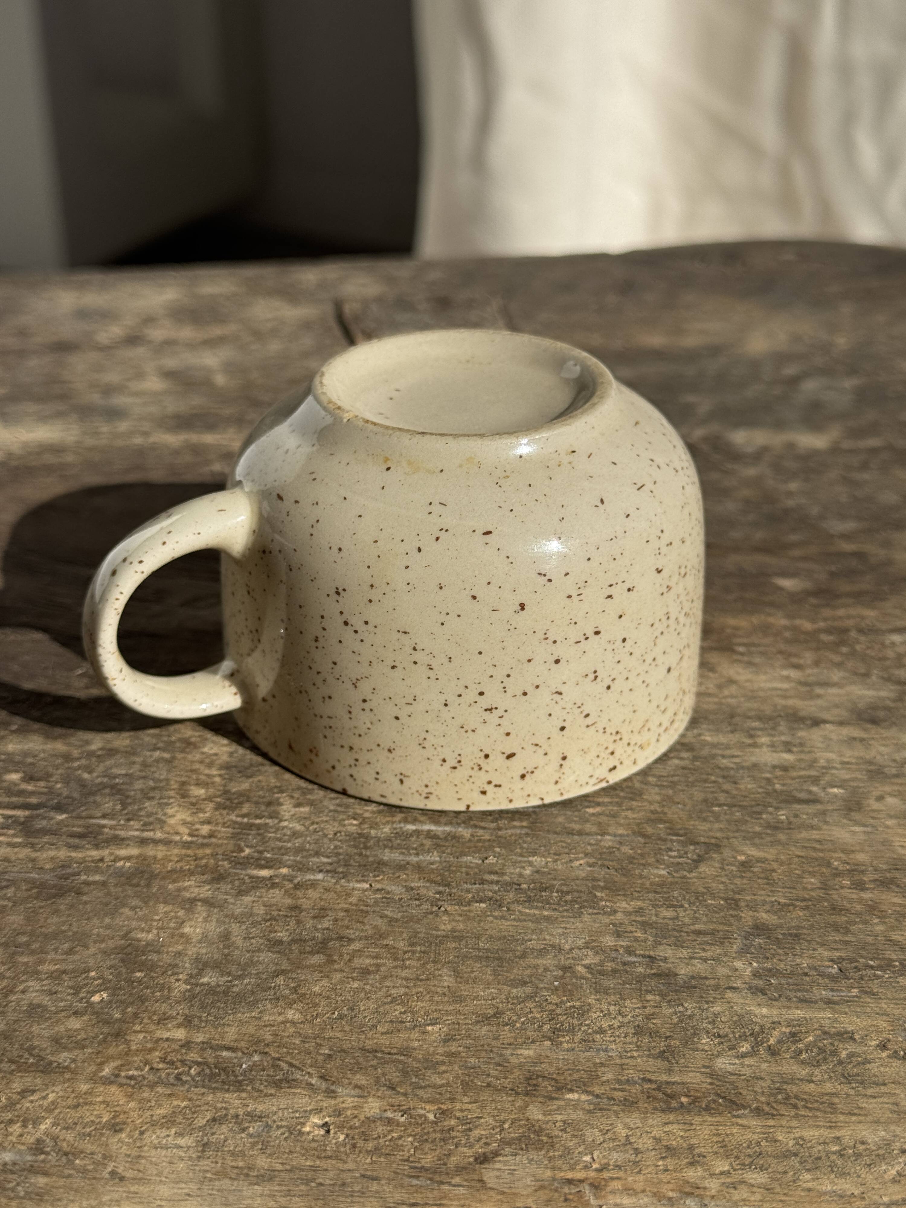 Set of 4 vintage speckled beige stoneware coffee cups.