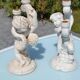 Pair of "cherub" candle holders in plaster
