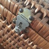 Bagged suitcase in braided wicker and wood