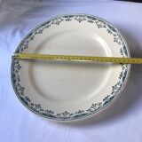 Round serving dish from the Longchamp earthenware factory, Doria model. Iron Land