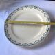 Round serving dish from the Longchamp earthenware factory, Doria model. Iron Land