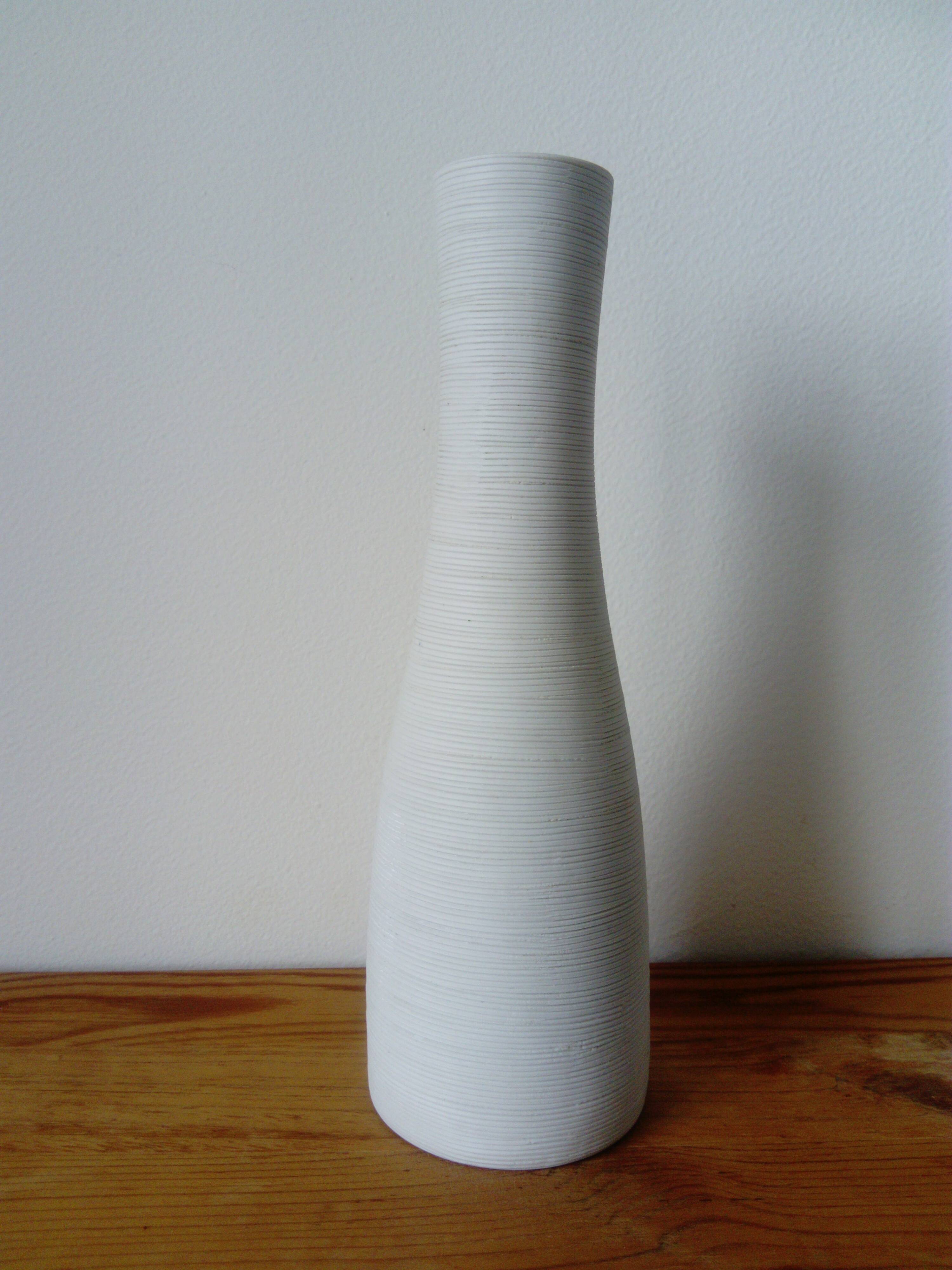 White ceramic vase with fine streaks