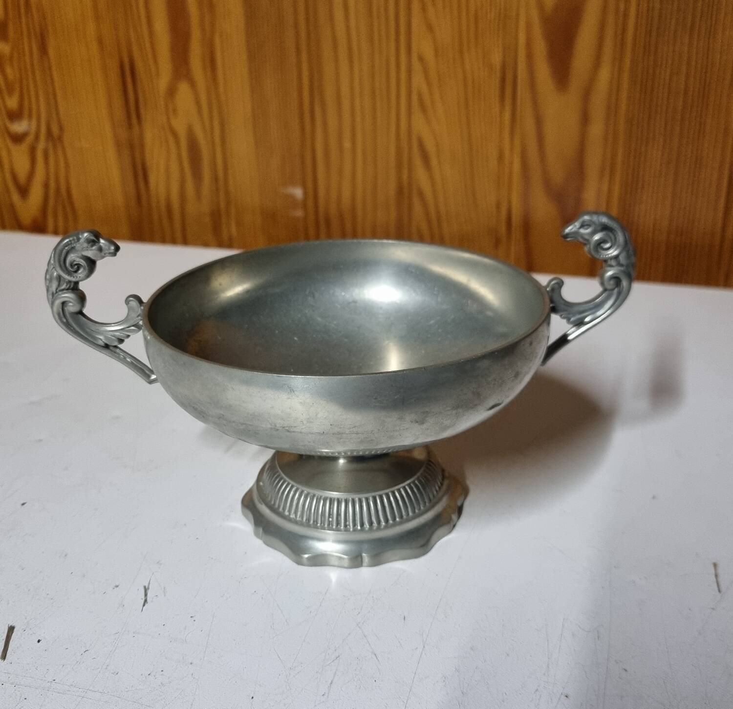 Burgundy footed cup in pewter with ram's head