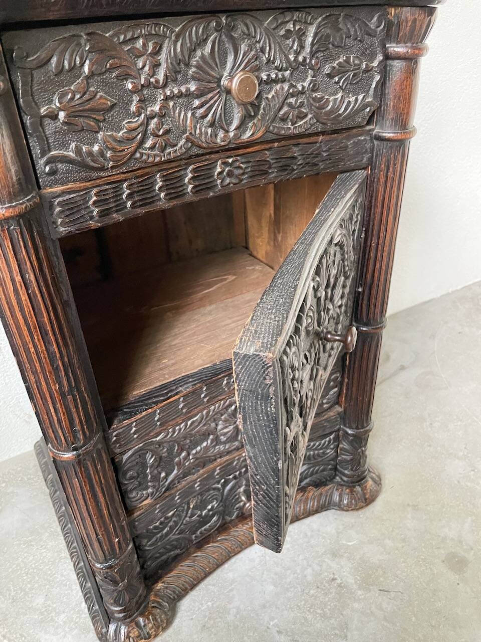 19th century chest of drawers in carved blackened pine