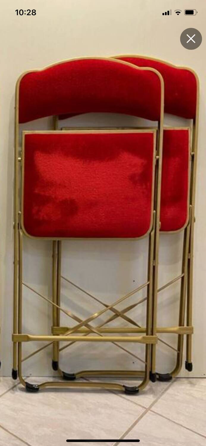 2 metal and red velvet chairs