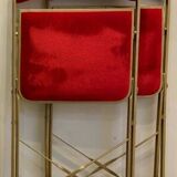 2 metal and red velvet chairs