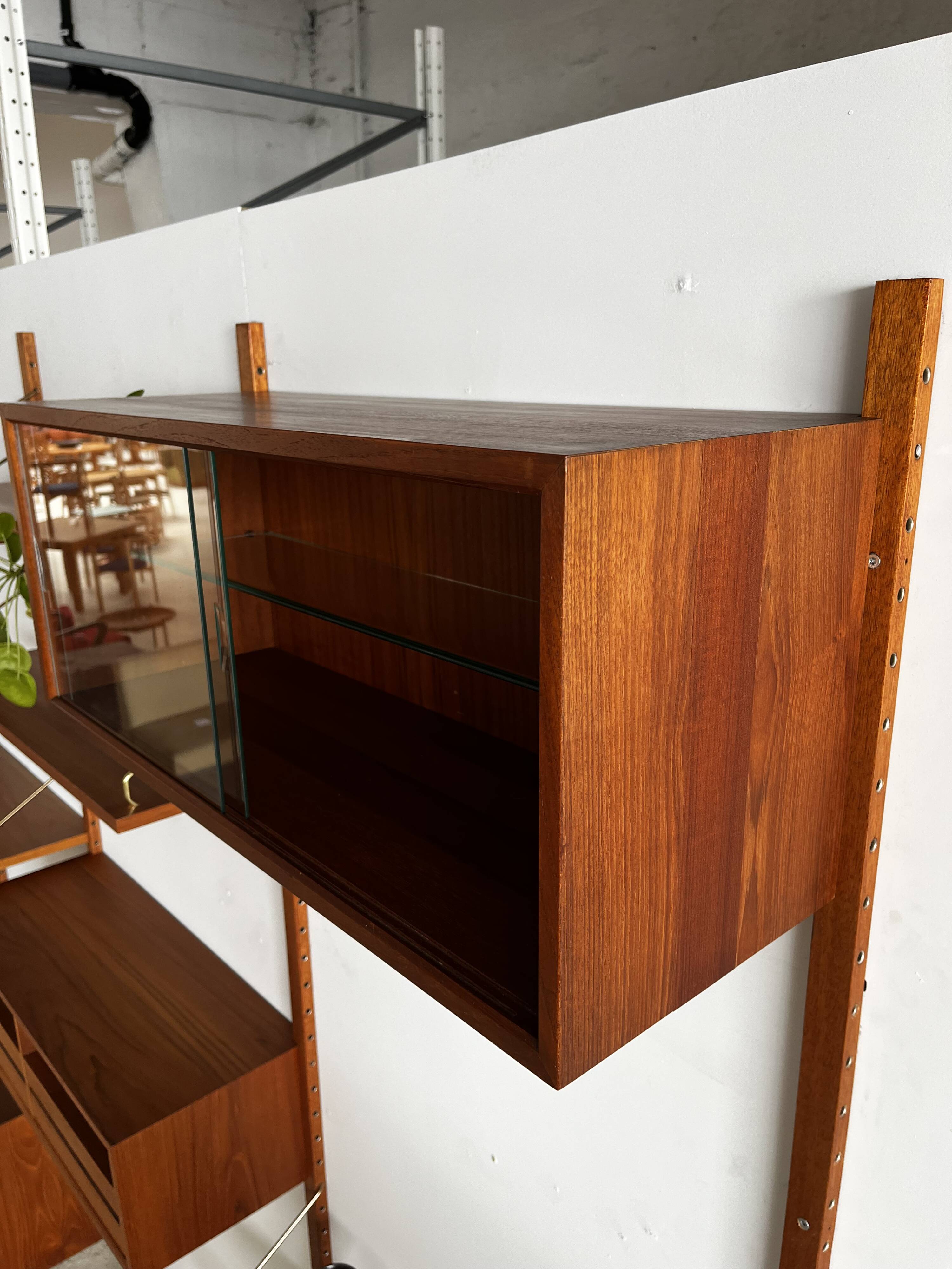 A wall unit with 4 compartments by Poul Cadovius, Denmark, 1960s.