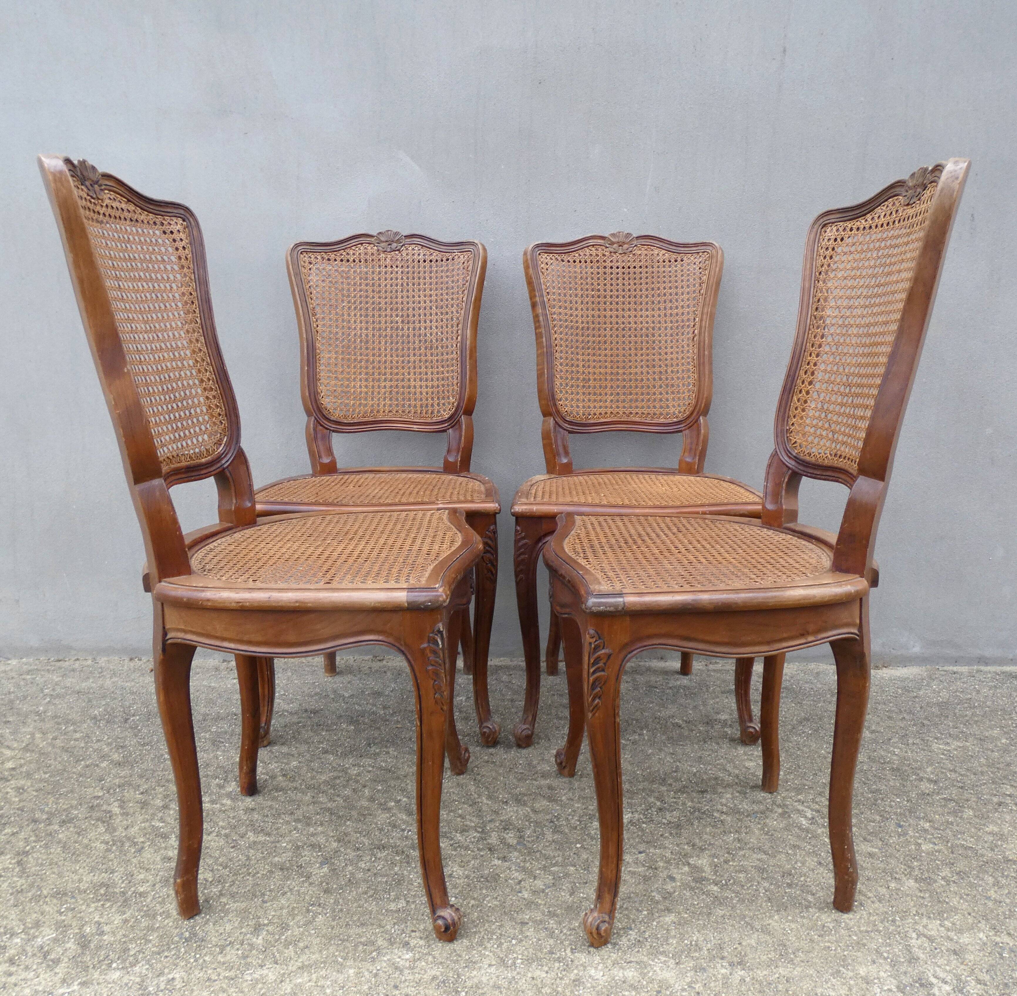 4 caned wooden chairs