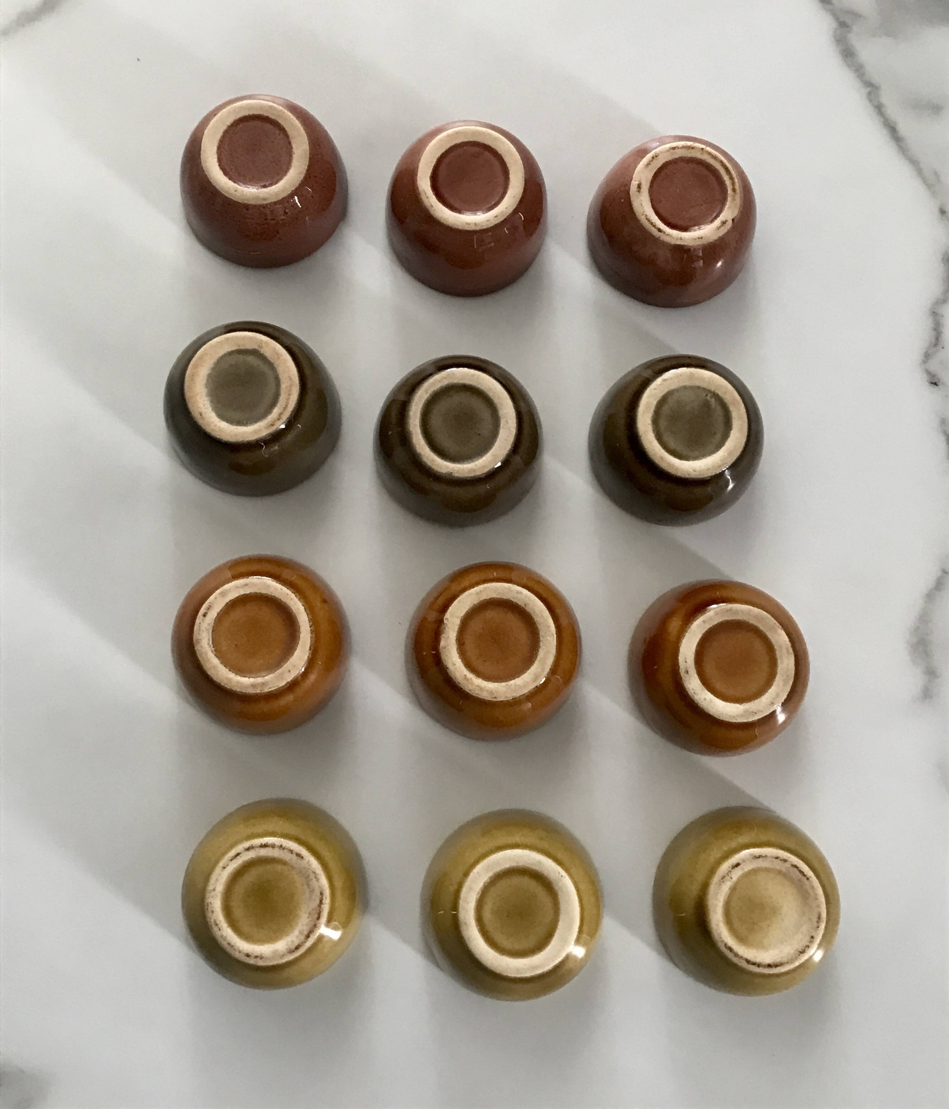 Set of 12 small multi-colored ceramic candle holders