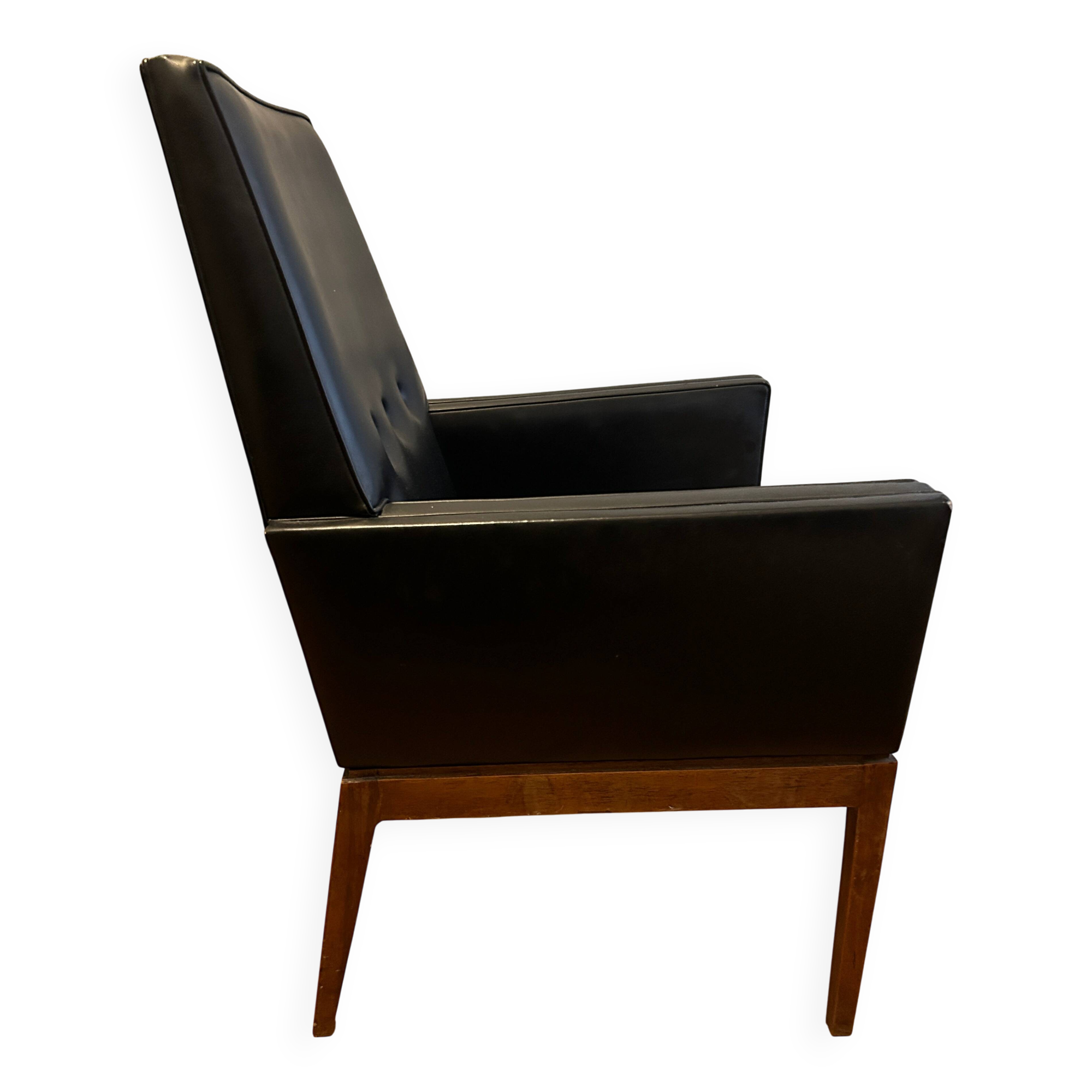 Modernist armchair in wood and black synthetic leather, circa 1960