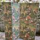 Wooden screen in Asian style, covered with Chinese wallpaper.