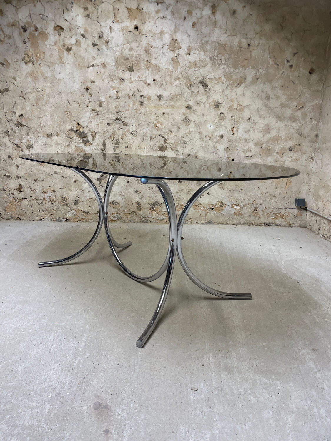 Smoked glass oval table from the 1970s.