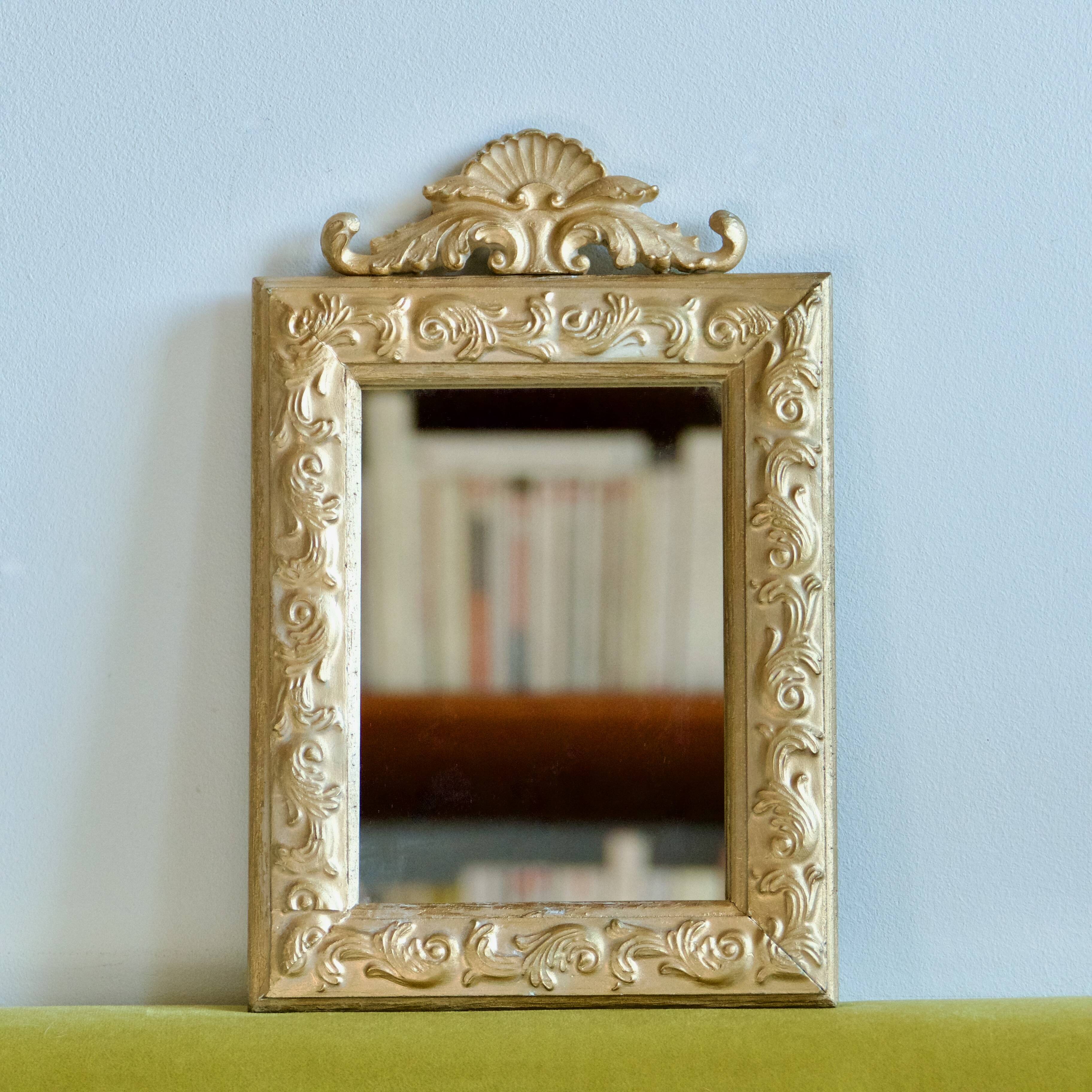 Antique gilded shell mirror with arabesque moldings