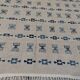 White and blue rug with Berber patterns, hand-woven in natural wool
