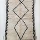 Moroccan Berber carpet Beni Ouarain unbleached with black diamonds and engraved border 207x130cm