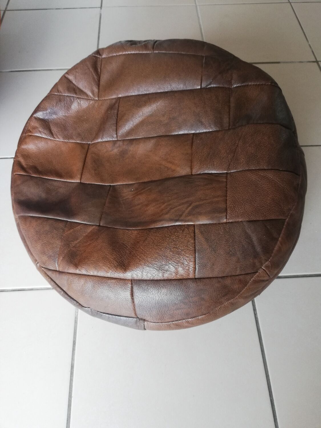 Brown round pouf imitation leather