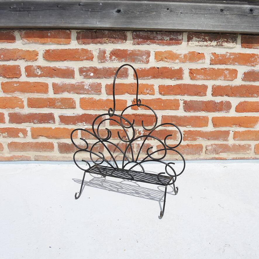 Old wrought iron magazine rack