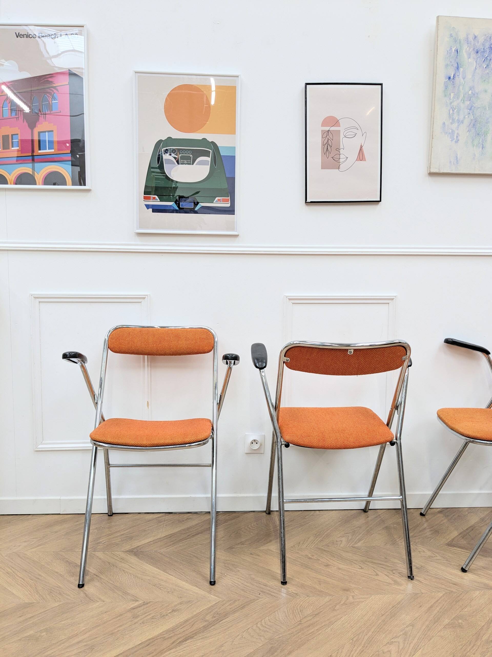 6 orange folding chairs
