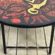 Vintage round coffee table in graphic red and yellow ceramic from the 1960s.