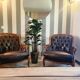 Pair of vintage Chesterfield club armchairs in brown tufted leather –