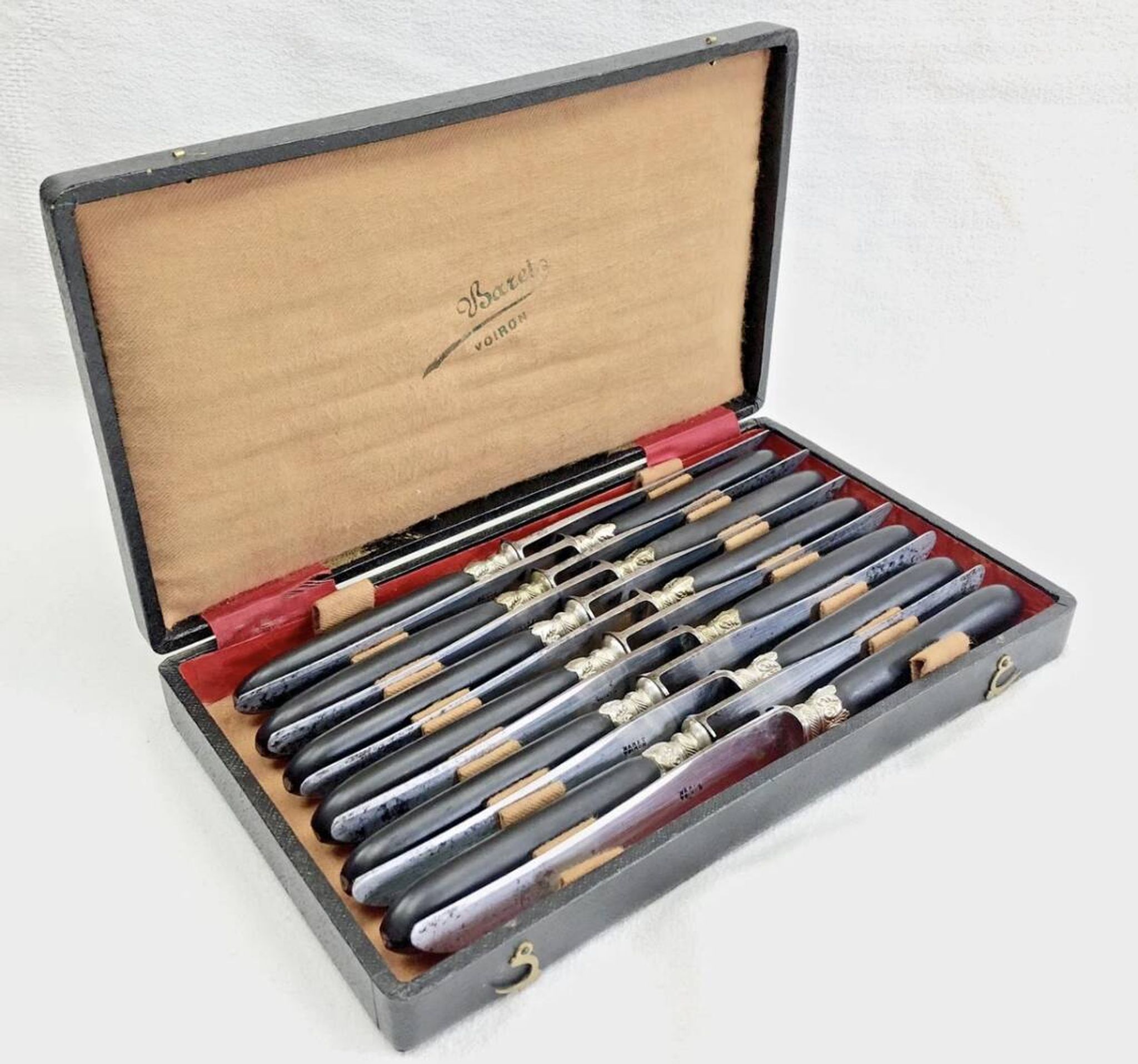 12 antique large table knives with ebony handles from the Napoleonic III period.