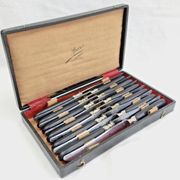 12 antique large table knives with ebony handles from the Napoleonic III period.