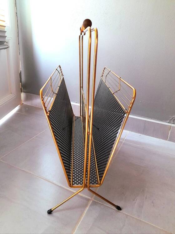 Perforated metal magazine rack, 1950