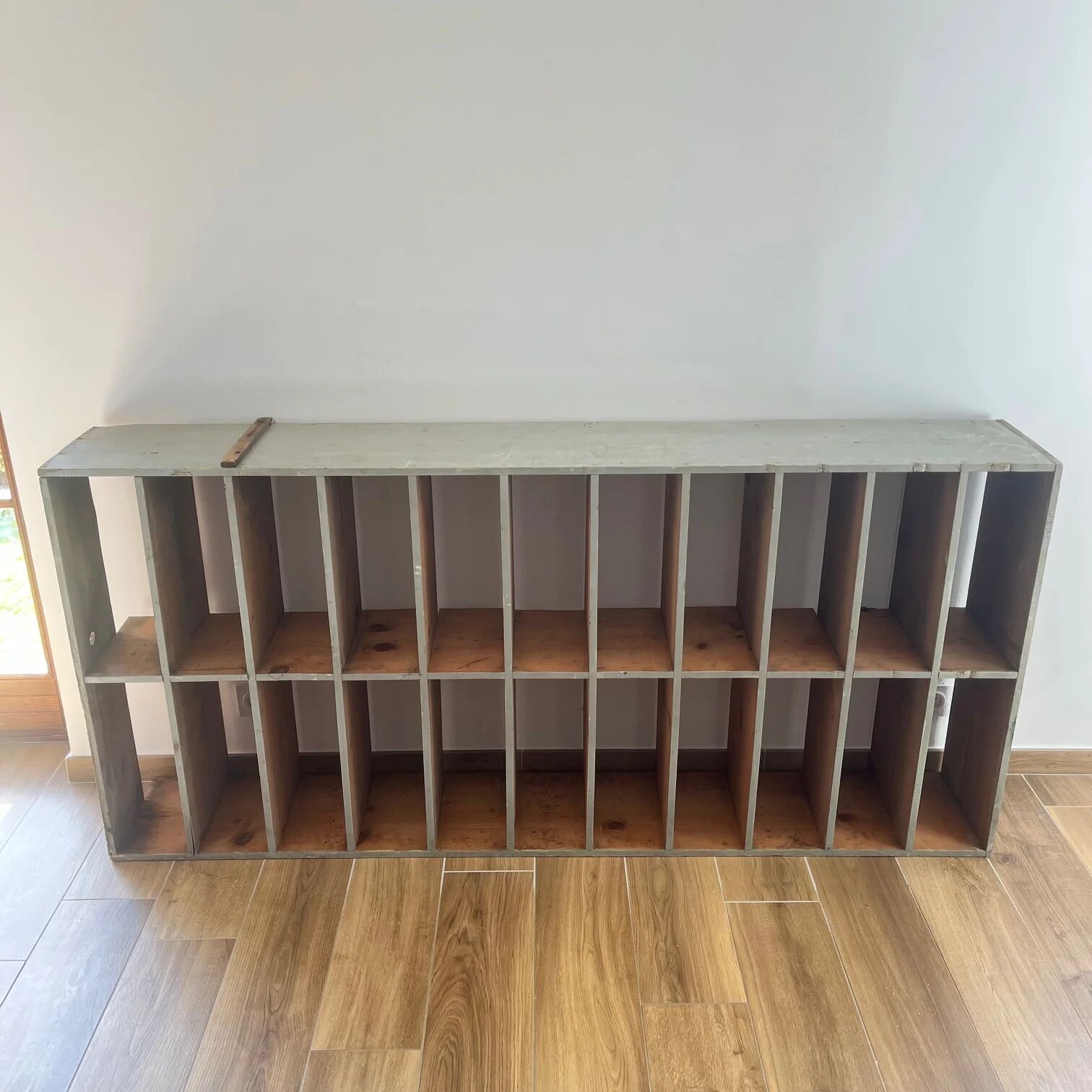 Large antique workshop cabinet with patinated wooden compartments, 20th century.