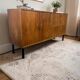 Vintage wooden sideboard with black steel legs.