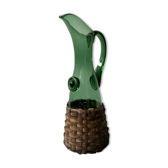 Service decanter in green glass and wicker contour