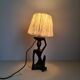 Ebony lamp with seated woman / 1930s