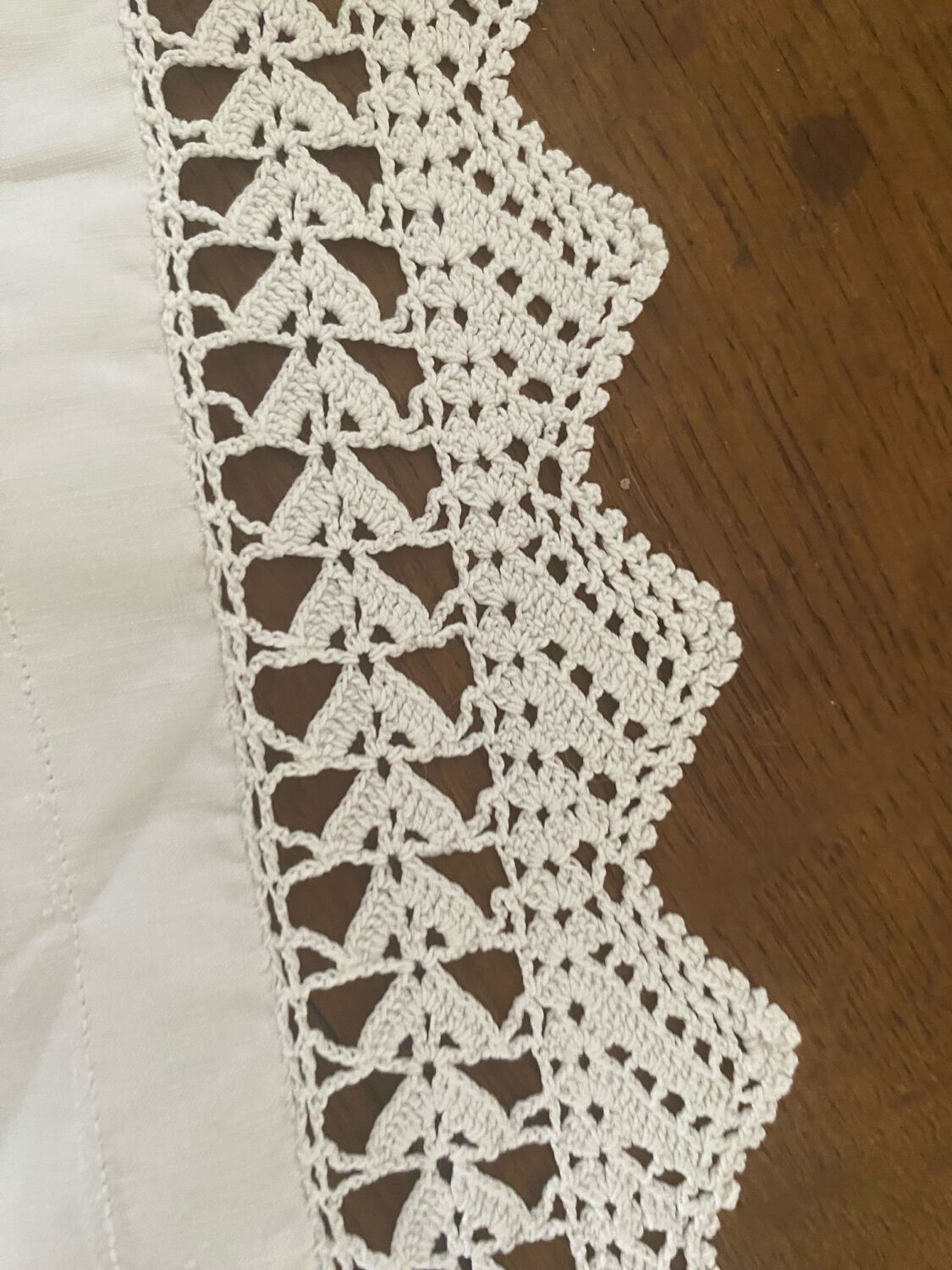 Antique white cotton pillowcase with crochet and monogram.