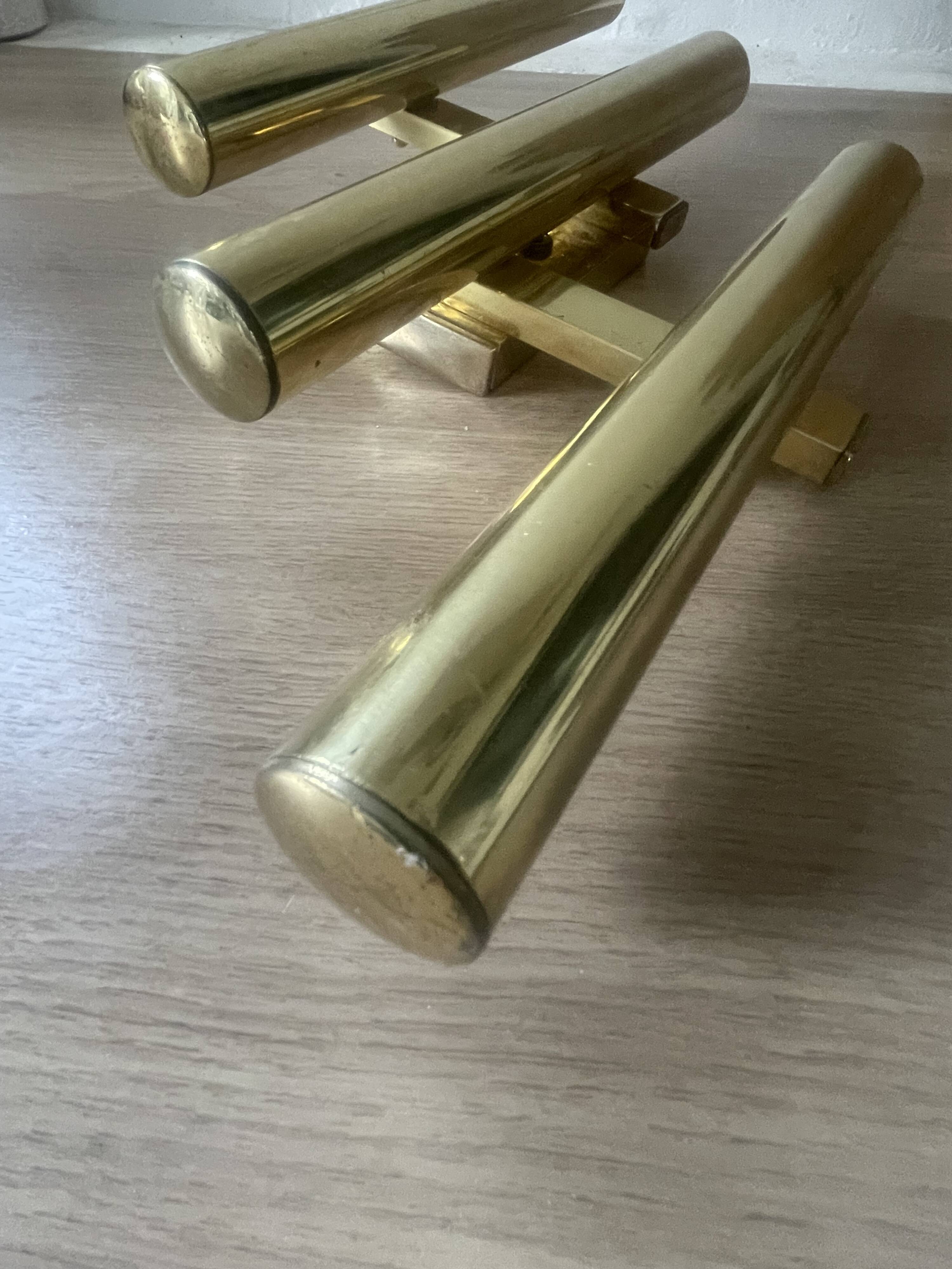 Tubular wall sconces in brass, Italian design from the 1970s, attributed.