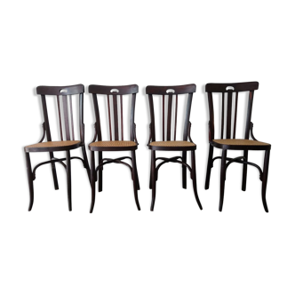 Suite de 4 chaises vintage de bistrot cannées en bois foncé