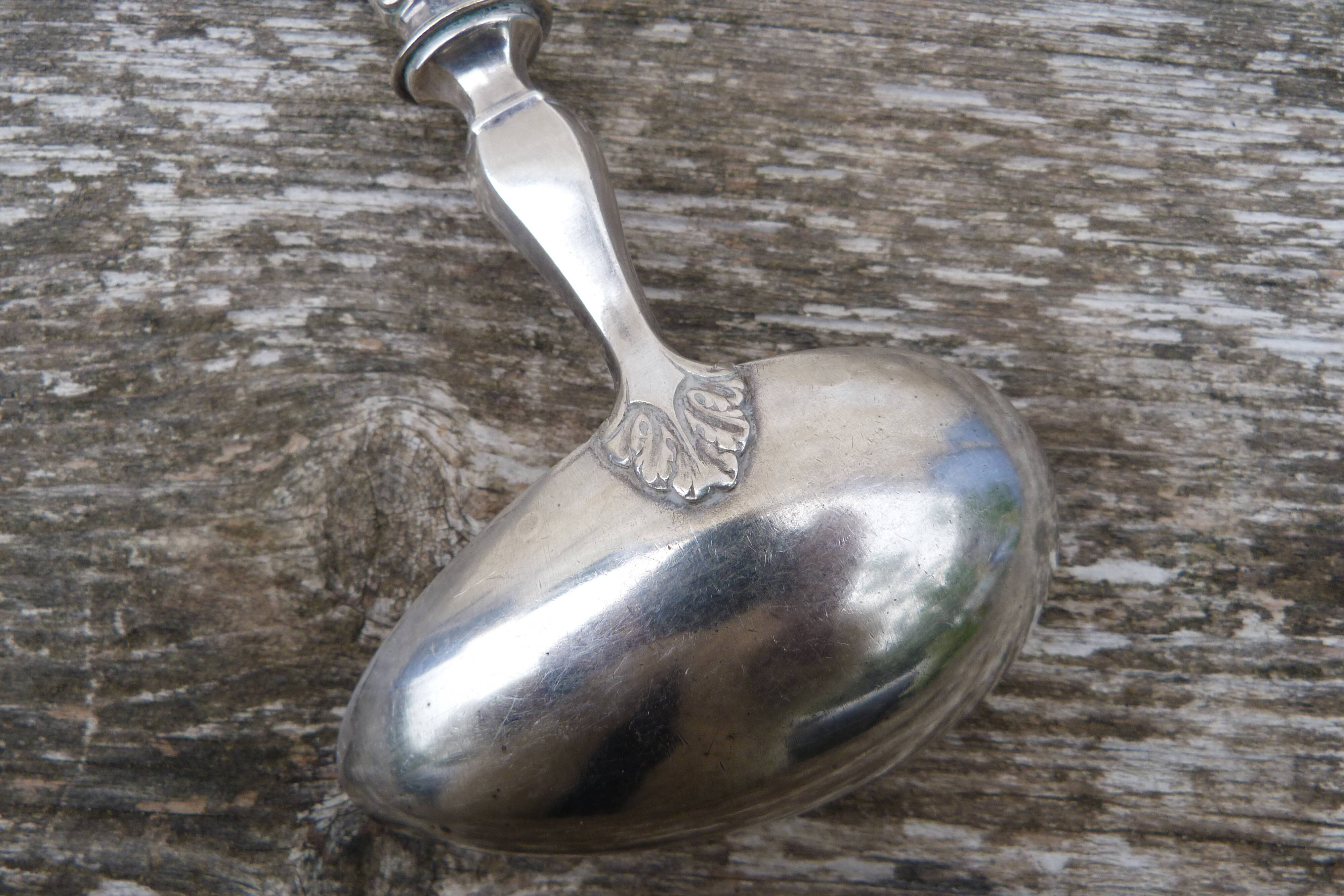 Old sauce spoon