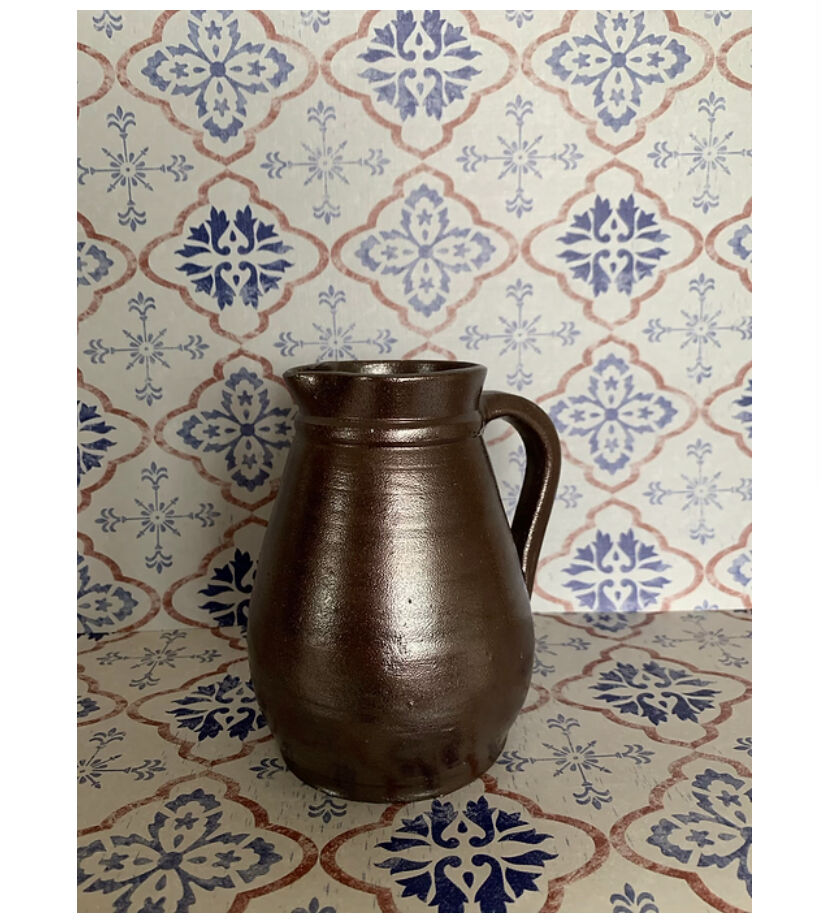 Pitcher in dark brown sandstone