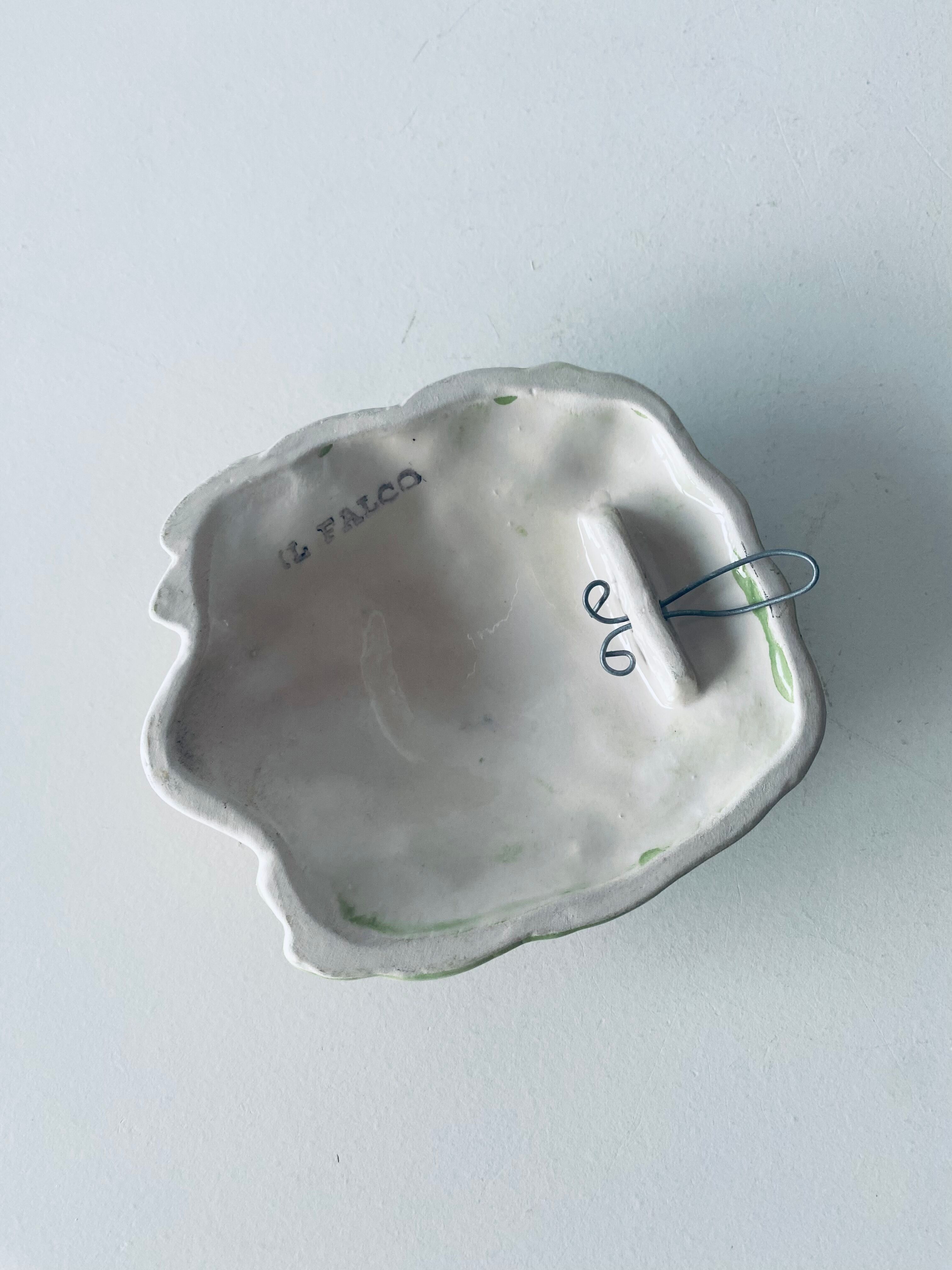 Ceramic wall face signed Il Falco