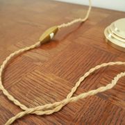 Desk lamp in brass with a swan neck and green opaline glass.