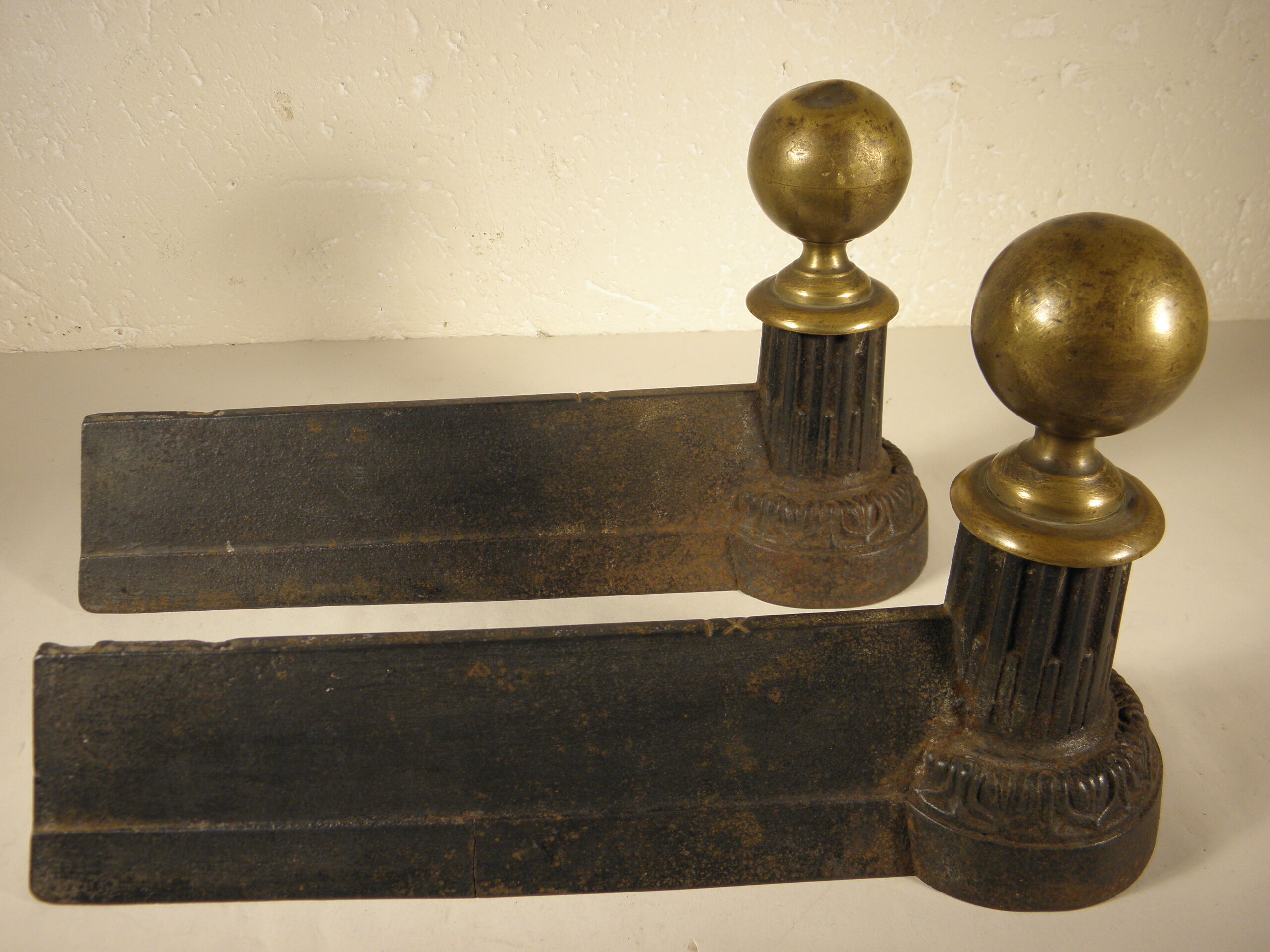 Pair of cast iron and brass chenets